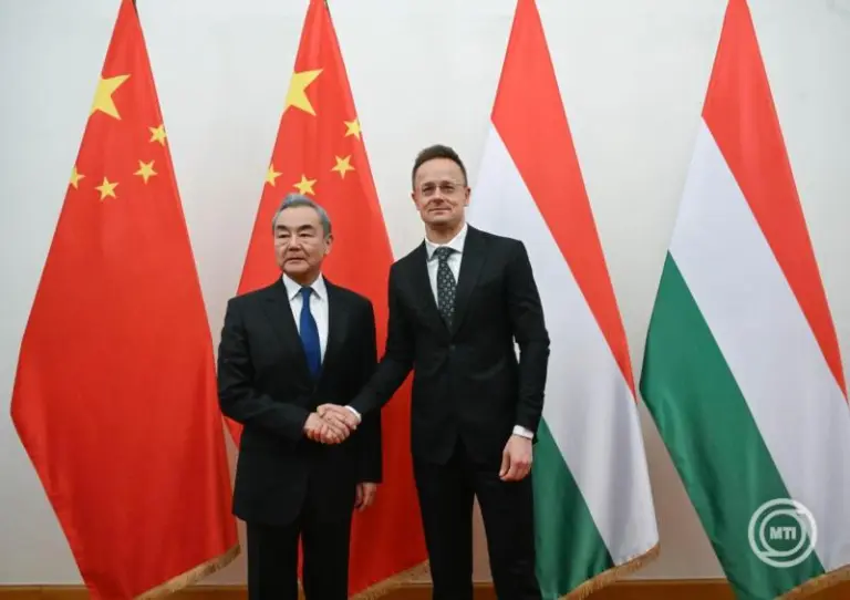Hungarian Minister of Foreign Affairs and Trade Peter Szijjarto (R) welcomes Chinese Foreign Minister Wang Yi in his office in Budapest, Hungary, 11 February 2026. MTI/Noemi Bruzak